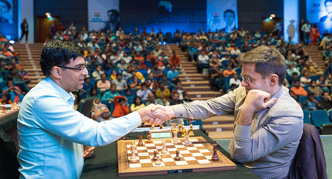 India's Viswathan Anand is congratulated by Levon Aronian after his win on Saturday
