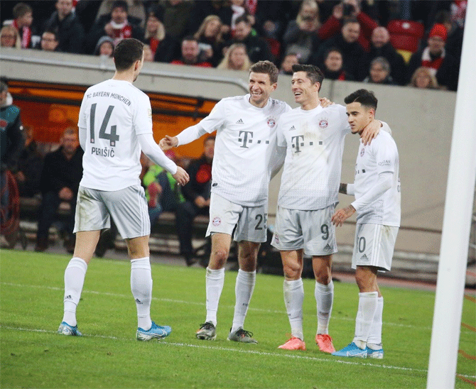 Bayern Munich players celebrate a goal against Fortuna Duesseldorf on Saturday