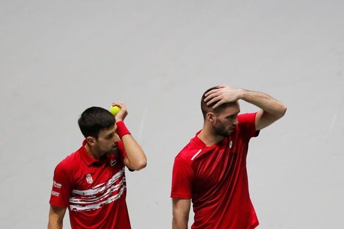 Serbia's Novak Djokovic and Viktor Troicki react after losing to Russia's Andrey Rublev and Karen Khachanov.