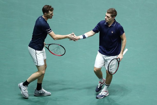 Britian's Jamie Murray and Neal Skupski react during their doubles match against Spain's Rafael Nadal and Feliciano Lopez