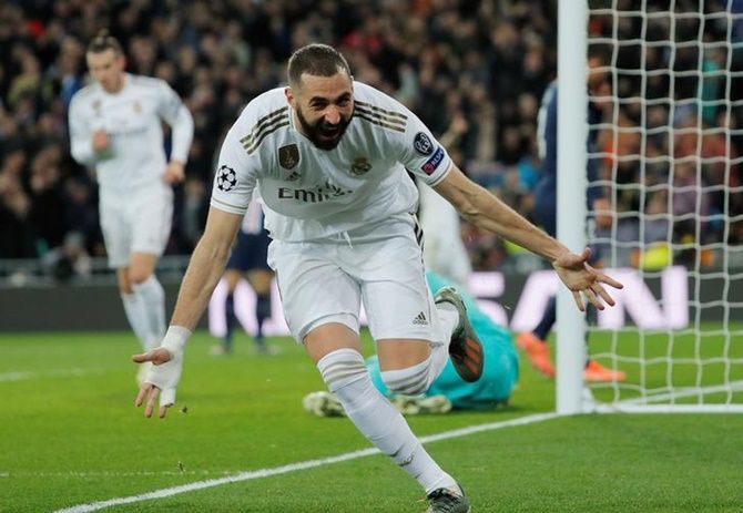Karim Benzema celebrates scoring Real Madrid's second goal in Tuesday's Champions League Group A match against Paris St Germain