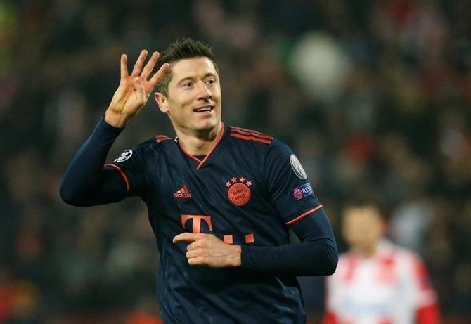 Robert Lewandowski celebrates scoring Bayern Munich's fifth goal, his fourth of the match against Red Star Belgrade