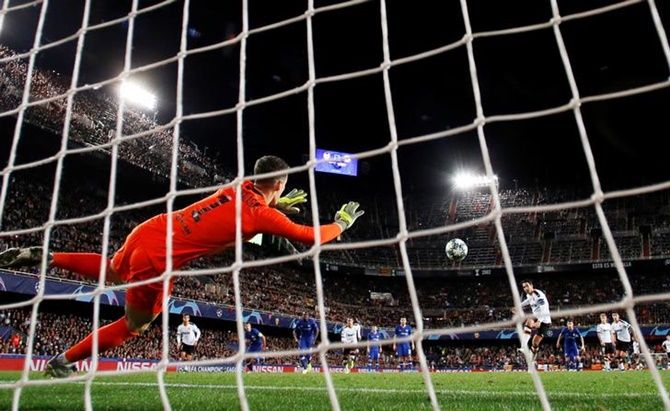 Chelsea's goalkeeper Kepa Arrizabalaga saves a penalty from Valencia's Dani Parejo.