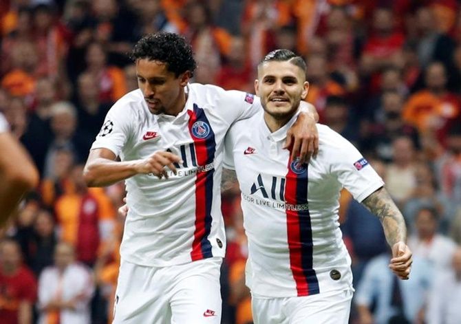 Mauro Icardi celebrates with teammate Marquinhos after scoring for Paris St Germain against Galatasaray.