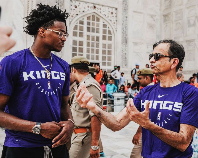 Sacramento Kings' De'Aaron Fox speaks with team owner Vivek Ranadive during their visit to the Taj Mahal on Wednesday, October 2.