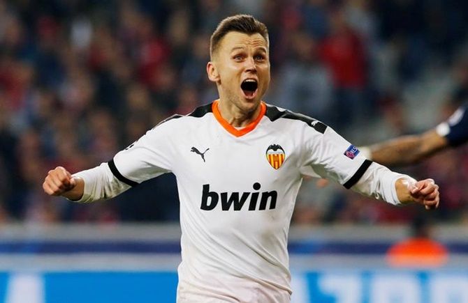 Denis Cheryshev celebrates scoring for Valencia in the Group H match against Lille