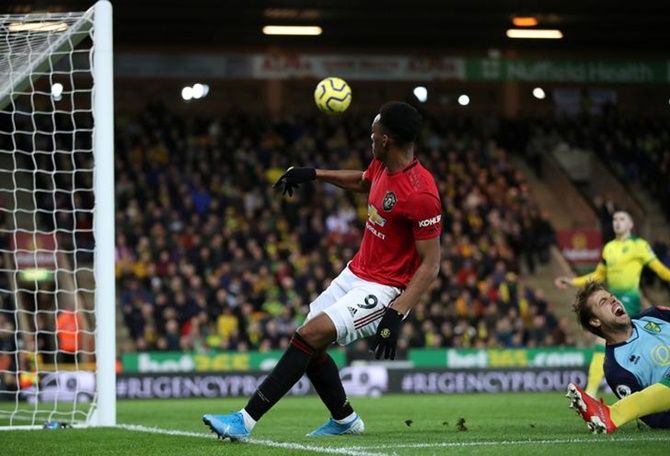 Anthony Martial scores Manchester United's third goal.