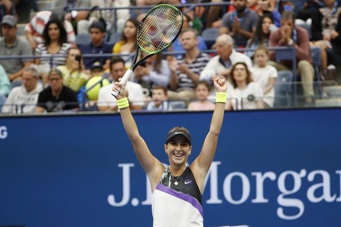 Belinda Bencic celebrates victory over Naomi Osaka at the US Open