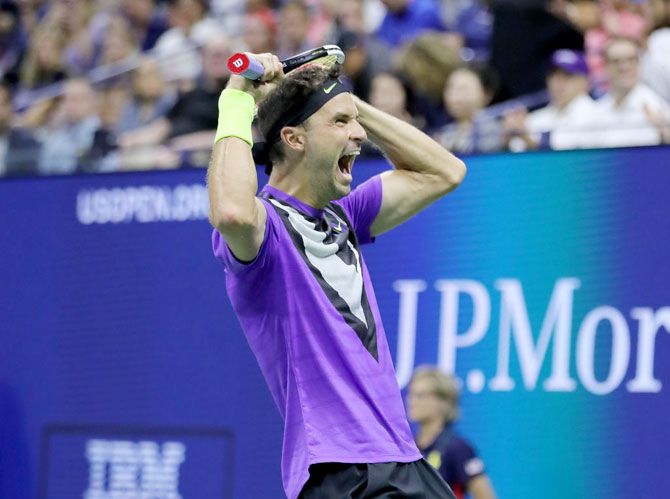 Bulgaria's Grigor Dimitrov celebrates his win over Switzerland's Roger Federer