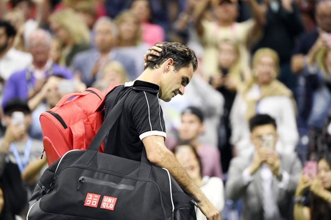 Switzerland's Roger Federer walks off the court after losing to Bulgaria's Grigor Dimitrov in a quarter-final match on day nine of the 2019 US Open tennis tournament on Tuesday