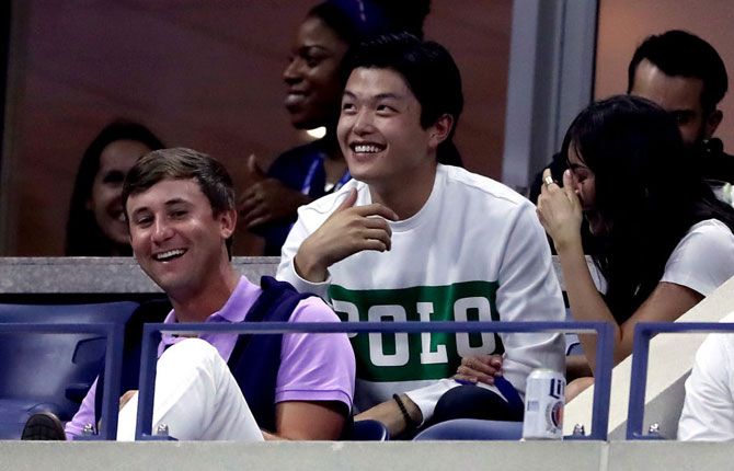 American ice dancer and Olympic medalist Alex Shibutani seems to be enjoying the action from the men's quarter-final between Roger Federer and Grigor Dimitrov