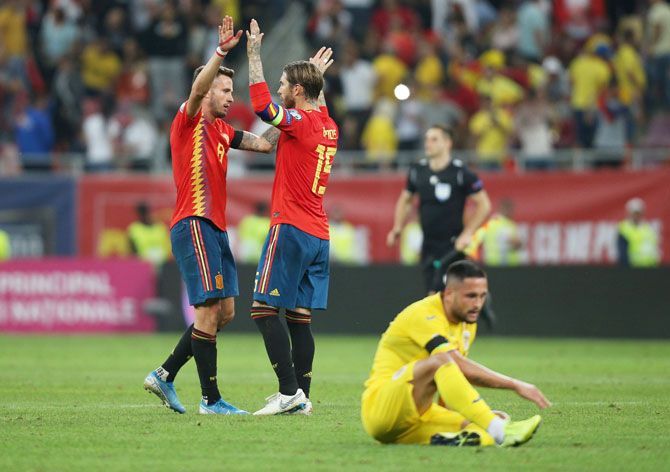 Spain's Saul Niguez and Sergio Ramos celebrate after defeating Romania in their Euro 2020 Qualifier Group F match at Arena Nationala, Bucharest in Romania on Thursday