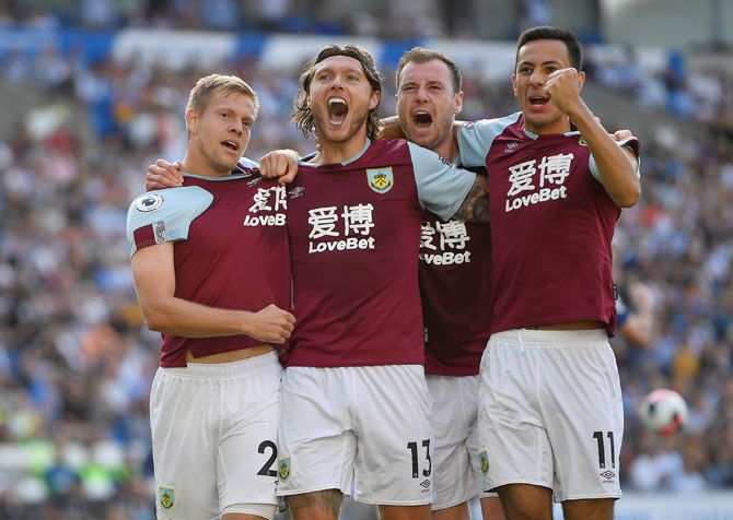 Burnley's Jeff Hendrick celebrates scoring with Matej Vydra and team mates after scoring their first goal