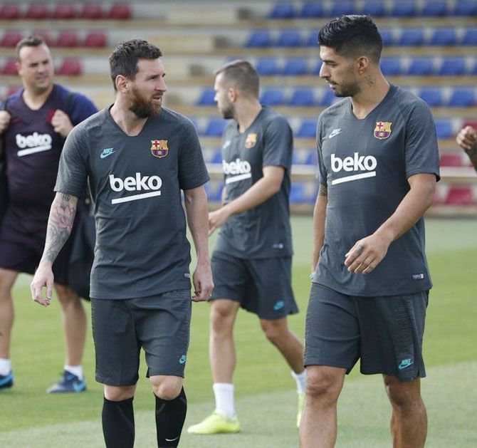 FC Barcelona's Lionel Messi and Luis Suarez at a training session on Monday