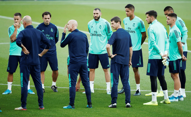 Real Madrid's Eden Hazard, Karim Benzema, and Raphael Varane during a training session at Parc des Princes in Paris on Tuesday