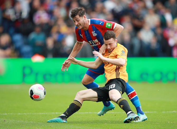 Wolverhampton Wanderers' Diogo Jota in action with Crystal Palace's Joel Ward during their match at Selhurst Park in London