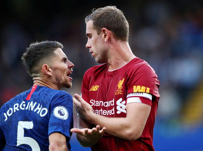 Chelsea's Jorginho clashes with Liverpool's Jordan Henderson