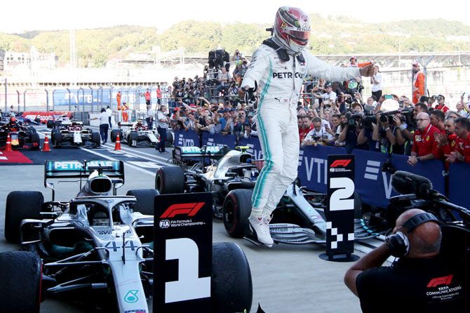 Race winner, Mercedes GP's British driver, Lewis Hamilton celebrates in parc ferme during the F1 Grand Prix of Russia at Sochi Autodrom in Sochi, Russia, on Sunday
