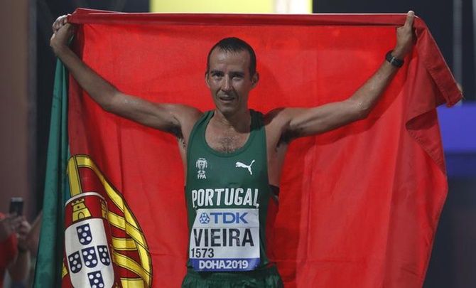 Portugal's Joao Vieira poses as he celebrates winning silver.