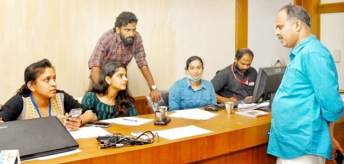 CK Vineeth at a meeting in the government helpline centre