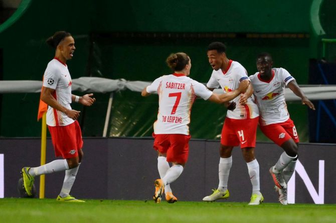 RB Leipzig's Tyler Adams celebrates with teammates after scoring the second goal at Estadio Jose Alvalade in Lisbon