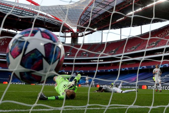 The ball hits the back of the net as FC Bayern Munich's David Alaba scores an own goal past keeper Manuel Neuer to help register FC Barcelona's first goal