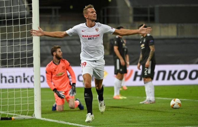 Sevilla's Luuk de Jong celebrates scoring their second goal against Manchester United at RheinEnergieSTADION in Cologne, Germany