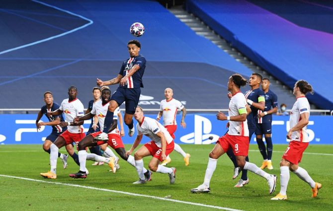 PSG's Marquinhos goes aerial as he heads in to score the opening goal