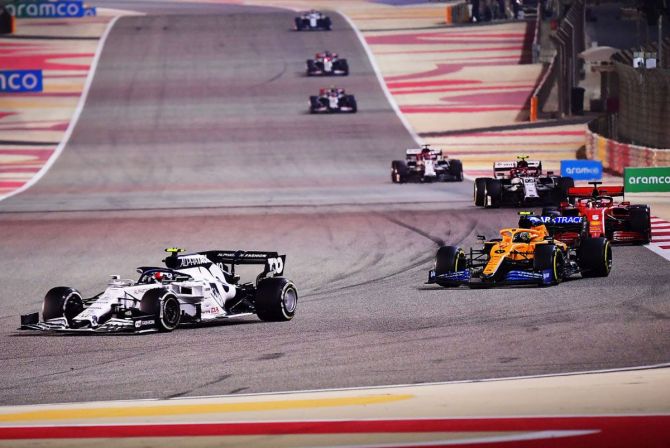 France's Pierre Gasly driving the (10) Scuderia AlphaTauri AT01 Honda leads Britain's Lando Norris driving the (4) McLaren F1 Team MCL35 Renault on track during Sakhir F1 GP on Sunday