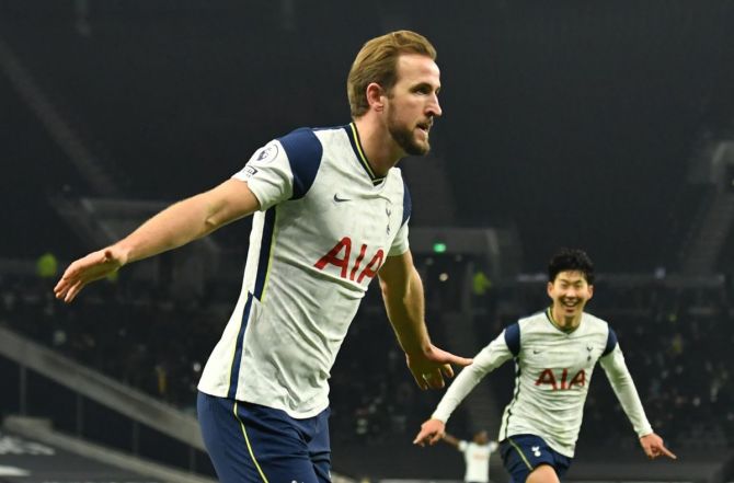 Tottenham Hotspur's Harry Kane celebrates with Son Heung-min Pool after scoring their second goal against Arsenal at Tottenham Hotspur Stadium, London 