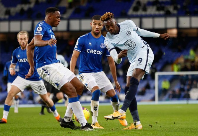 Chelsea's Tammy Abraham in a battle for the ball with Everton players during their match at Goodison Park in Liverpool 