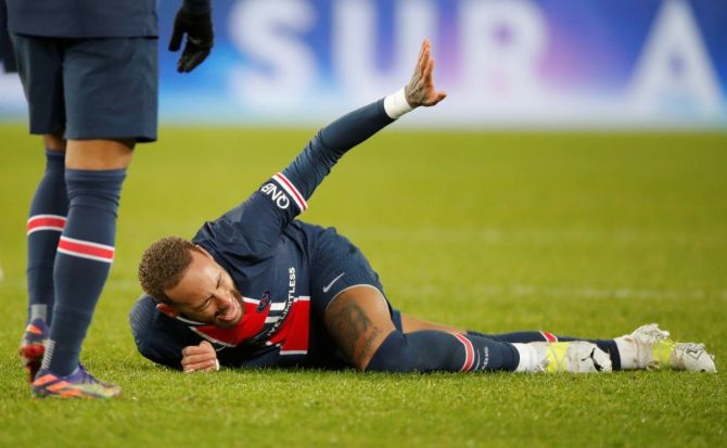 Paris St Germain's Neymar reacts after sustaining an injury during their Ligue 1 match against Olympique Lyonnais at Parc des Princes, Paris on Sunday 