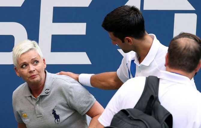 Novak Djokovic speaks to the line judge who was hit with the ball during his fourth round match against Pablo Carreno Busta on Day 7 of the 2020 US Open in New York, on Sunday