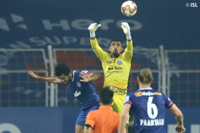 Jamshedpur FC's goalkeeper TP Rehenesh tries to block an attempt at goal during the ISL match against Bengaluru at Fatorda Stadium in Margao on Monday