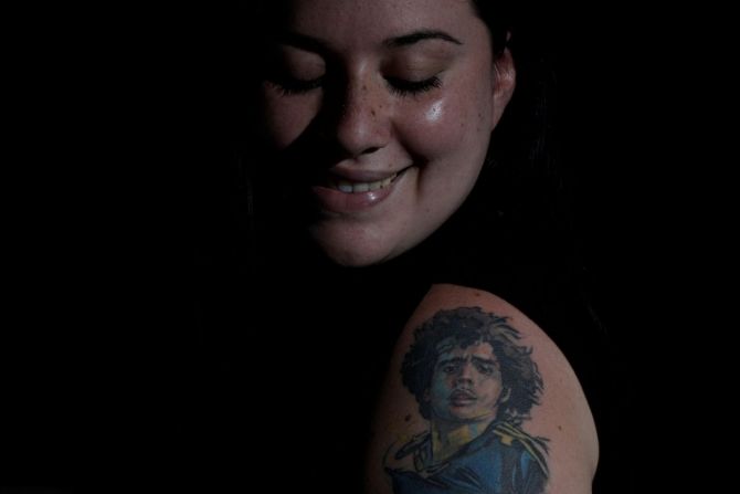 Nerea Barbosa poses for a photo at her home in Buenos Aires.  "It is love, it is my great love, my passion to have Diego (on my body) so he is always with me everywhere. I feel like he protects me," said Barbosa. 