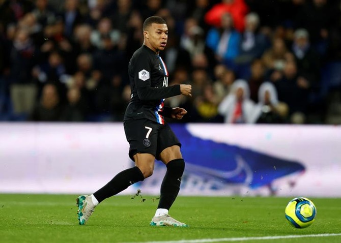 Kylian Mbappe scores Paris St Germain's fourth goal against Montpellier in Saturday's Ligue 1 match