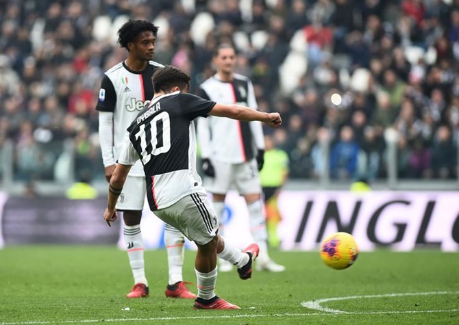 Paulo Dybala scores Juventus's opening goal from a free-kick during Sunday's Serie A match against Brescia, at Allianz Stadium, in Turin. 