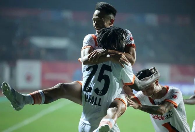 Goa FC's Jackichand celebrates with Mourtada Fall after scoring in Wednesday's ISL match against Jamshedpur FC.