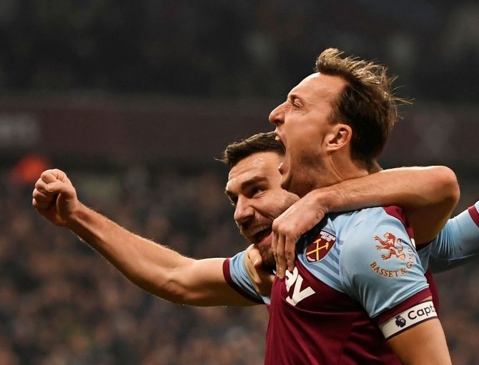 West Ham United's Mark Noble celebrates scoring their first goal against AFC Bournemouth at London Stadium in London