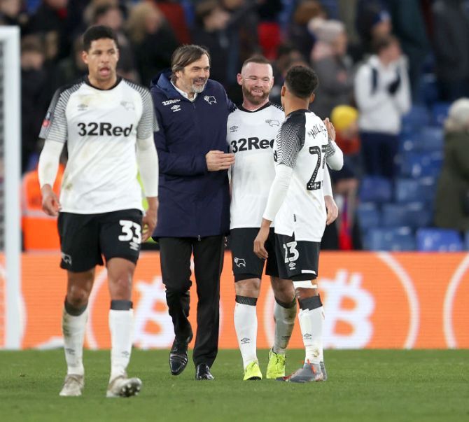 Phillip Cocu, Manager of Derby County celebrates with Wayne Rooney following their win in the FA Cup third round match against Crystal Palace at Selhurst Park in London on Sunday