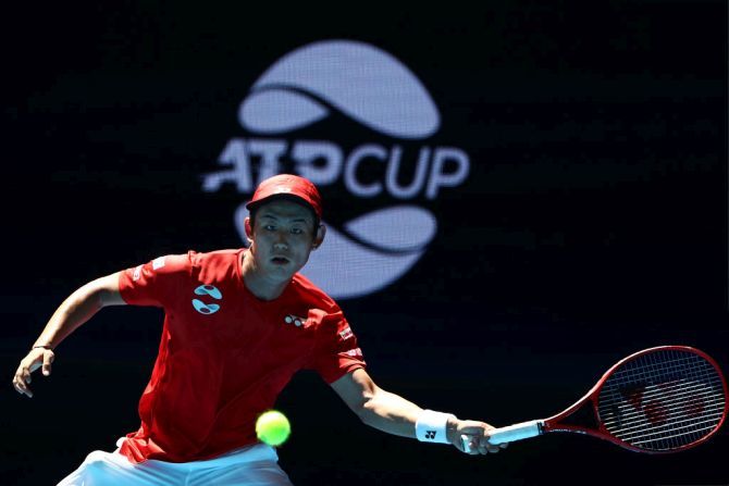 Team Japan's Yoshihito Nishioka in action against Team Georgia's Nikoloz Basilashvili during day four of the 2019 ATP Cup Group Stage at RAC Arena in Perth on Monday