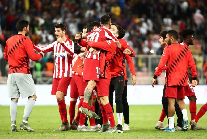 Atletico Madrid's Angel Correa celebrates with teammates after win over Barcelona to reach the Super Cup final at King Abdullah Sports City in Jeddah, Saudi Arabia, on Thursday