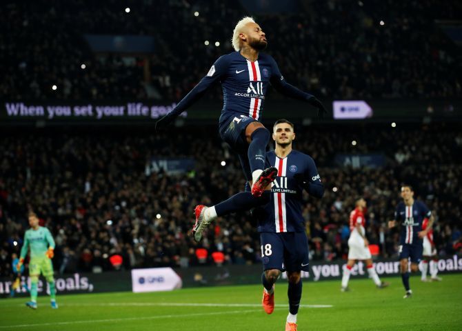 Paris St Germain's Neymar celebrates after scoring their third goal from the penalty spot during their Ligue 1 match against AS Monaco at Parc des Princes in Paris on Sunday 