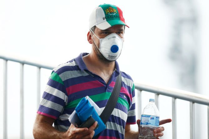A fan wears a respiratory mask during 2020 Australian Open Qualifying at Melbourne Park in Melbourne on Tuesday