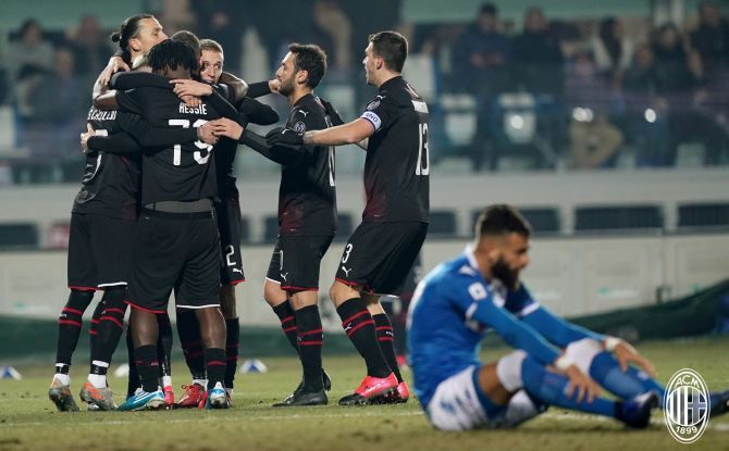 AC Milan players celebrate after scoring against Brescia in their Serie A match at San Siro on Friday