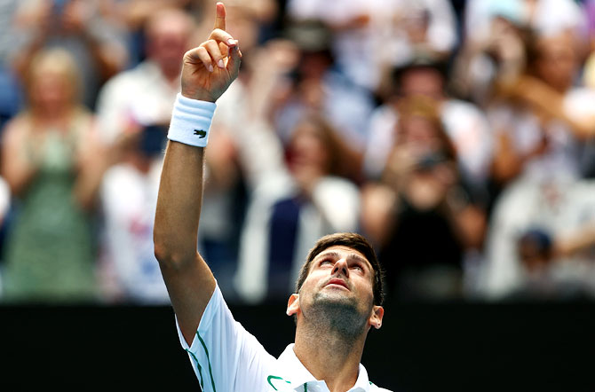 Serbia's Novak Djokovic celebrates after winning-match point against Diego Schwartzman of Argentina. 