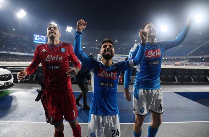 Napoli's Lorenzo Insigne celebrates with teammates after the Serie A match against Juventus, in Naples, on Sunday.
