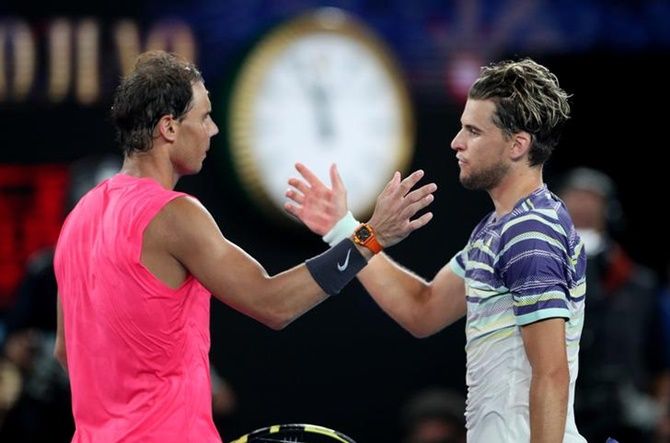 Dominic Thiem and Rafael Nadal meet at the net after their quarter-final.