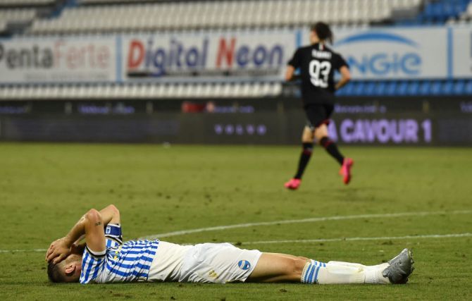 SPAL's Francesco Vicari reacts in disappointment after scoring an own goal against AC Milan during their Serie A match at Stadio Paolo Mazza in Ferrara, Italy.