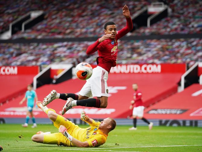 Manchester United's Mason Greenwood and Bournemouth's Aaron Ramsdale in action during their match at Old Trafford 